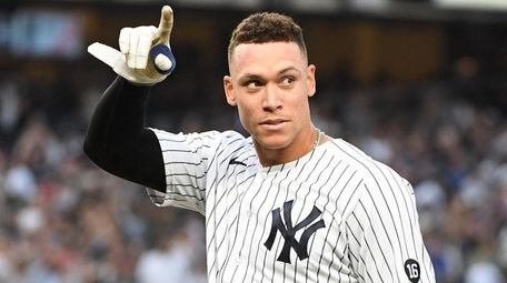 The Yankees' Aaron Judge acknowledges fans after his