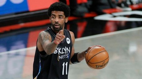 Kyrie Irving (11) of the Nets calls a