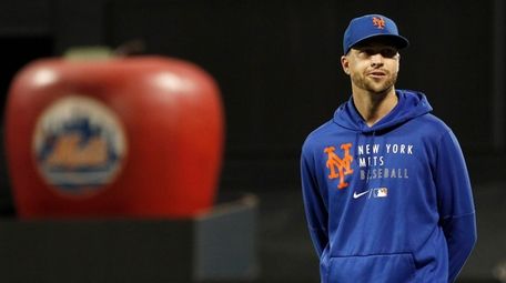 Jacob deGrom of the Mets looks on before