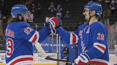 Mika Zibanejad #93 and Chris Kreider #20 of