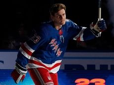 Adam Fox of the Rangers is introduced before