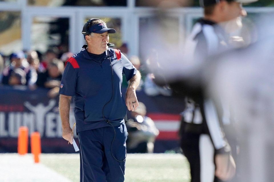 New England Patriots head coach Bill Belichick walks