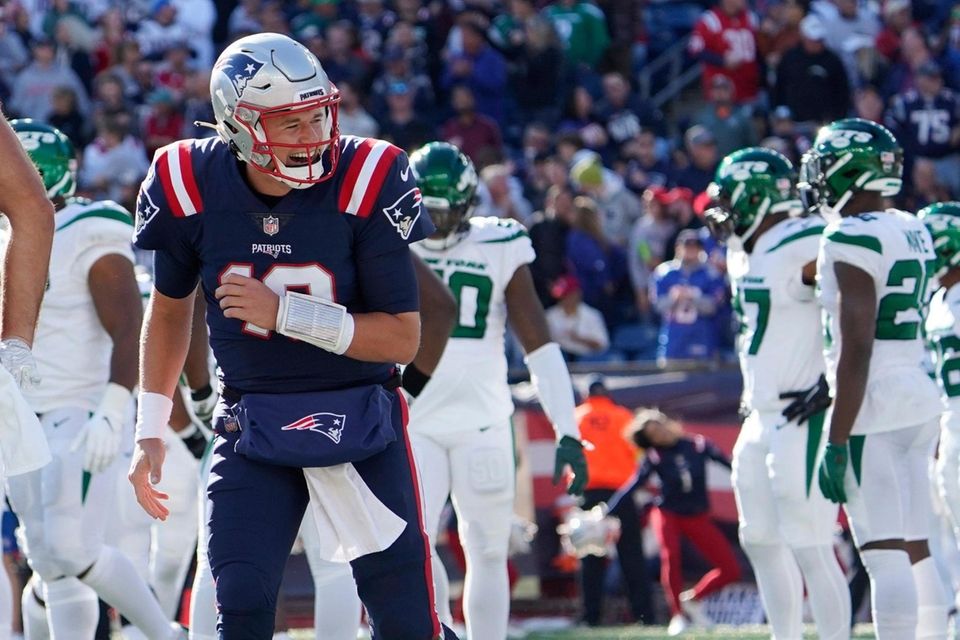 New England Patriots quarterback Mac Jones (10) celebrates