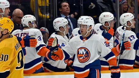 Islanders right wing Oliver Wahlstrom (26) is congratulated