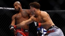 Al Iaquinta punches Bobby Green in their lightweight