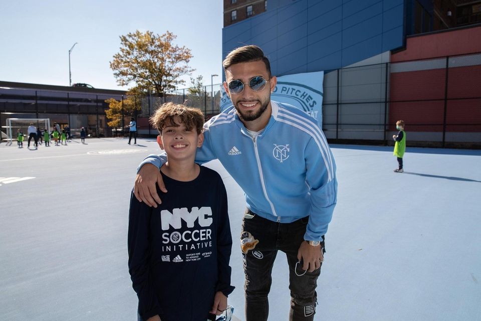 NYCFC's Valentin Castellanos (right) meets a student at