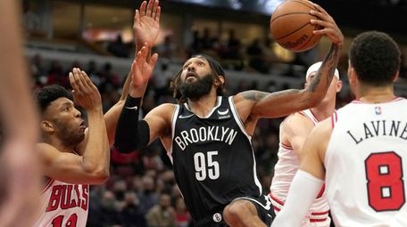 Nets' DeAndre' Bembry (95) drives to the basket