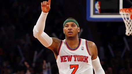 Carmelo Anthony of the Knicks celebrates after assisting