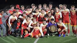 Chaminade boys soccer team with their Championship plaque
