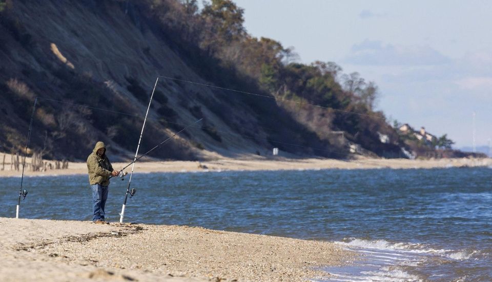 A fisherman tries his luck at Sunken Meadow