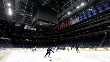 The New York Islanders skate during practice at