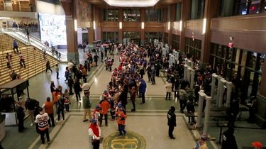 Fans arrive for a game between the Islanders