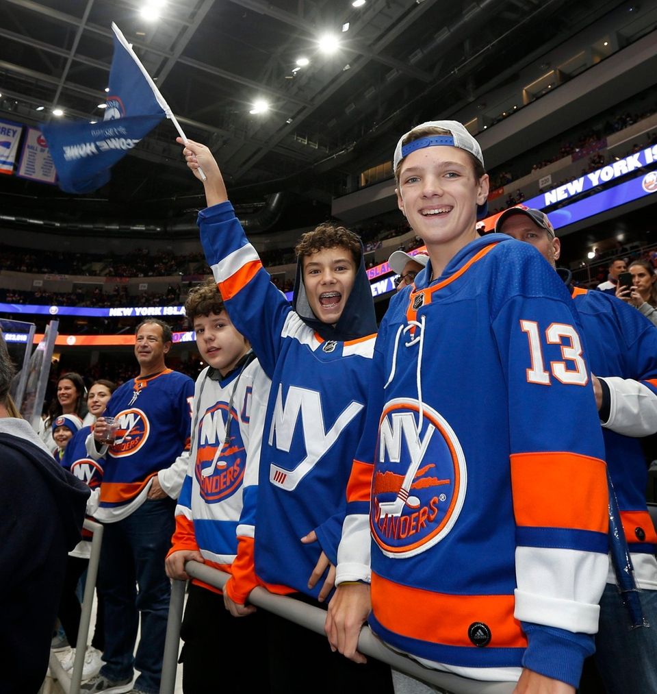 Fans cheer as the Islanders warm up before