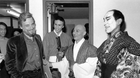 Stephen Sondheim, left, poses backstage with cast members