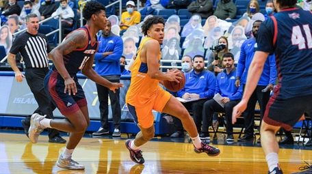 Hofstra guard Omar Silverio (15) goes to the