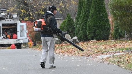 A man uses a leaf blower as light