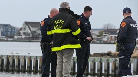 Suffolk police officers and arson investigators Sunday morning
