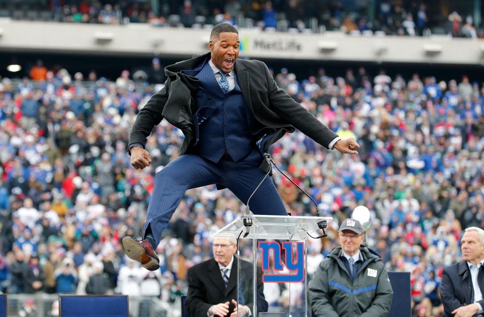 Former Giant Michael Strahan speaks during his jersey