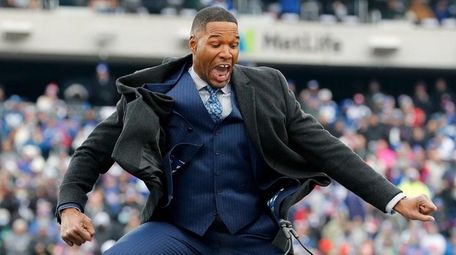 Former Giant Michael Strahan speaks during his jersey