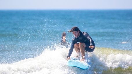 Tom Casse, an instructor with CoreysWave, rides a