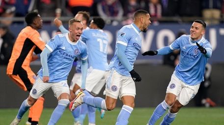 New York City FC players celebrate after defeating
