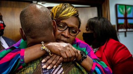 Ahmaud Arbery's mother, Wanda Cooper-Jones, is hugged by