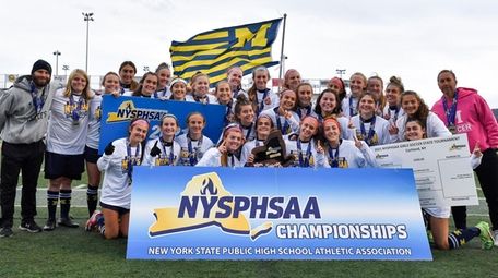 Massapequa poses for a photo after their win