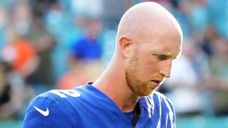 Mike Glennon of the Giants walks off the