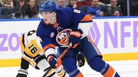 New York Islanders defenseman Noah Dobson skates with