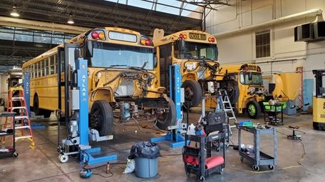 School buses being converted by Unique Electric Solutions