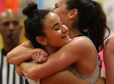 Our lady of Mercy's Samantha Shea (12) hugs