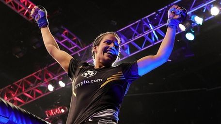 Julianna Pena celebrates after defeating Amanda Nunes of