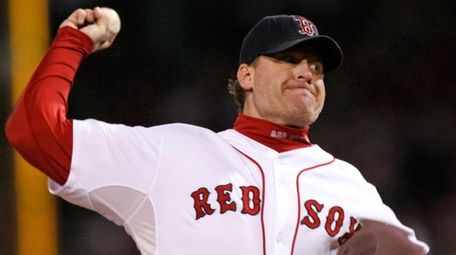 The Red Sox's Curt Schilling pitches against the