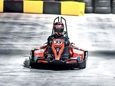 An electric go-kart racer stands by to make
