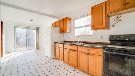 The kitchen has laminate countertops and a retro