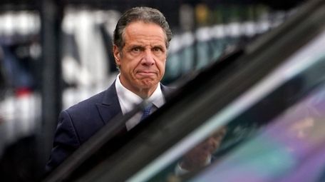 Gov. Andrew Cuomo prepares to board a helicopter