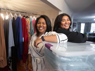 Taylor, left, and Sydney Davis, with clothing they