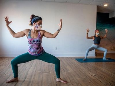 Bec Gathmann-Landini teaches a yoga class on Dec.