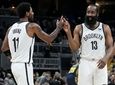 The Nets' Kyrie Irving and James Harden celebrate