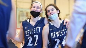 Riley Weiss #24 of Hewlett, right, and teammate