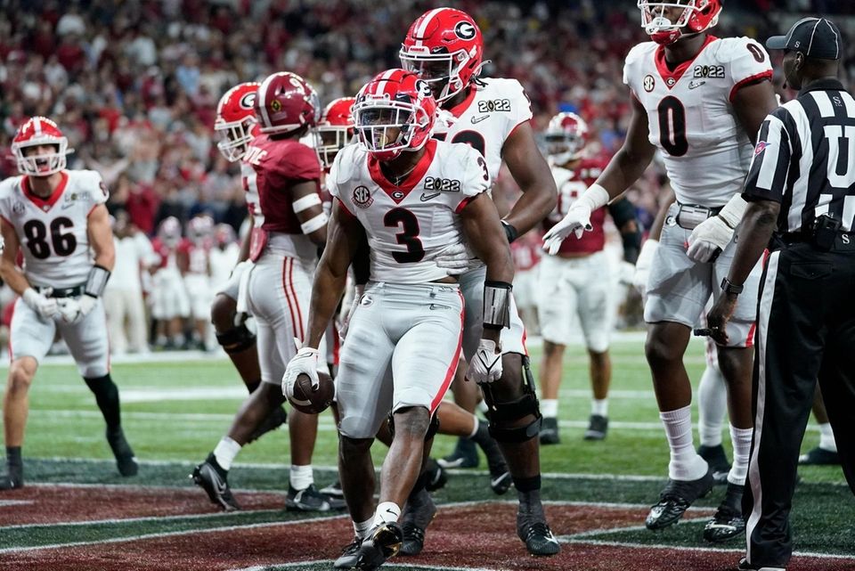 Georgia's Zamir White celebrates after running for a