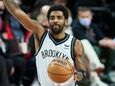 Nets guard Kyrie Irving gestures during the first