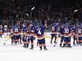 New York Islanders players acknowledge fans after their