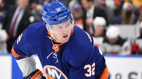 Islanders left wing Ross Johnston sets before a