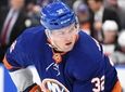 Islanders left wing Ross Johnston sets before a