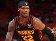 Cam Reddish of the Hawks drives to the