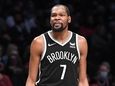 Nets forward Kevin Durant looks on in the