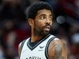 Nets guard Kyrie Irving looks toward the bench