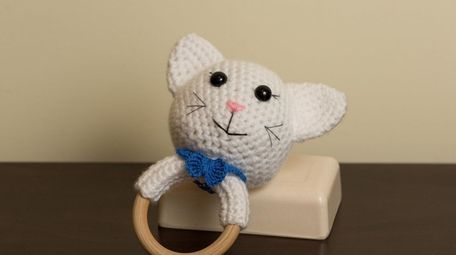 A cat rattle crocheted by Pooja Hathiramani of