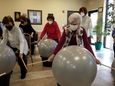 Using giant balls set in buckets that they